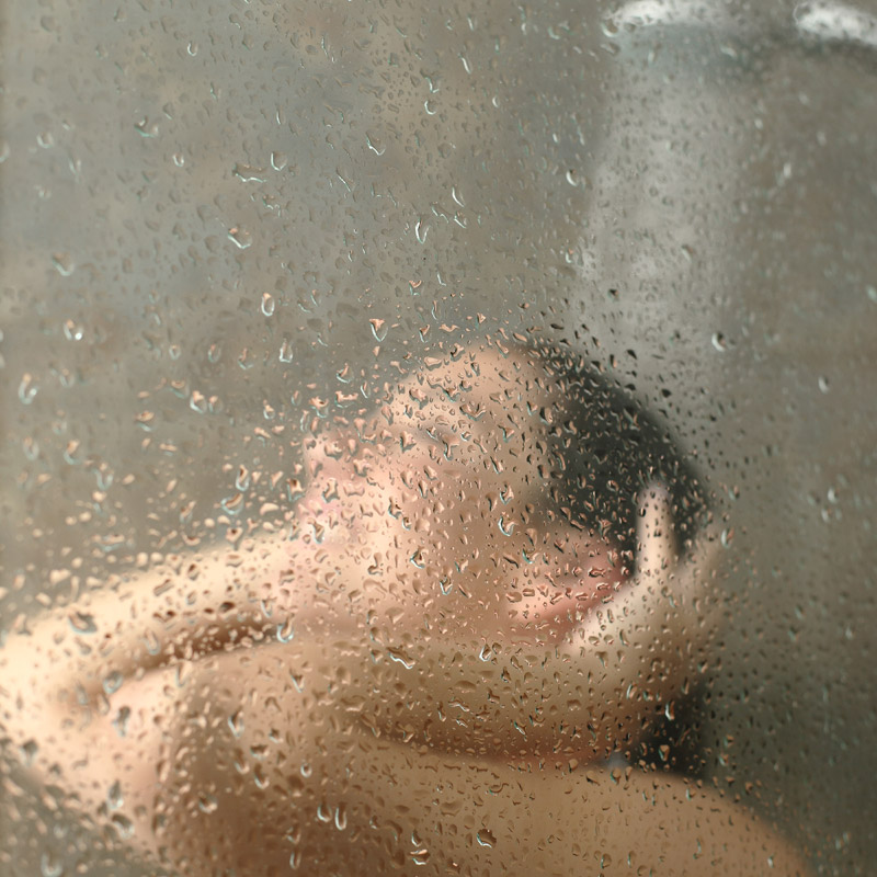 Woman in hot shower