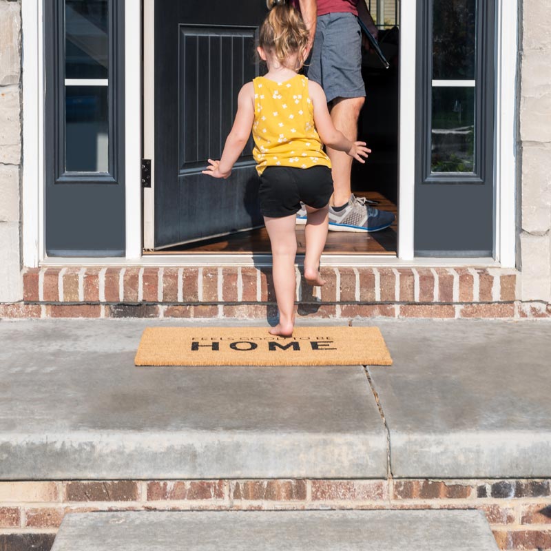 Girl walking into house